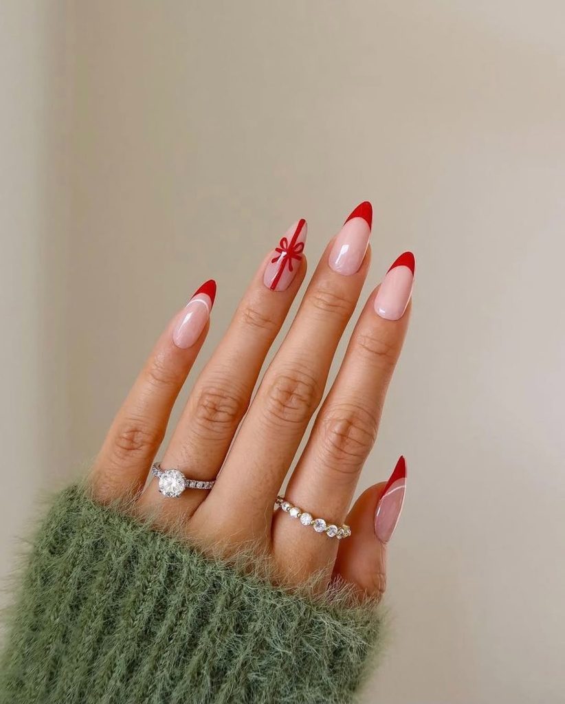 Nude nails with a classic red french tip