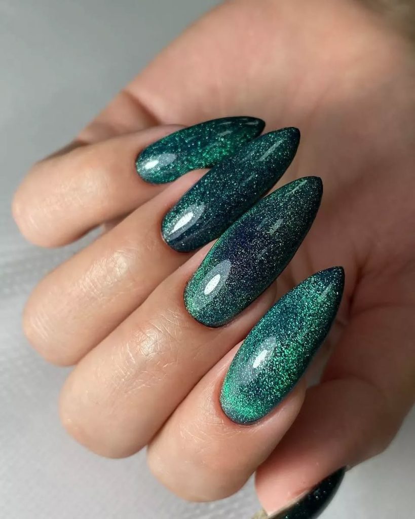 Stiletto nails in hunter green with magnetic cat-eye shimmer