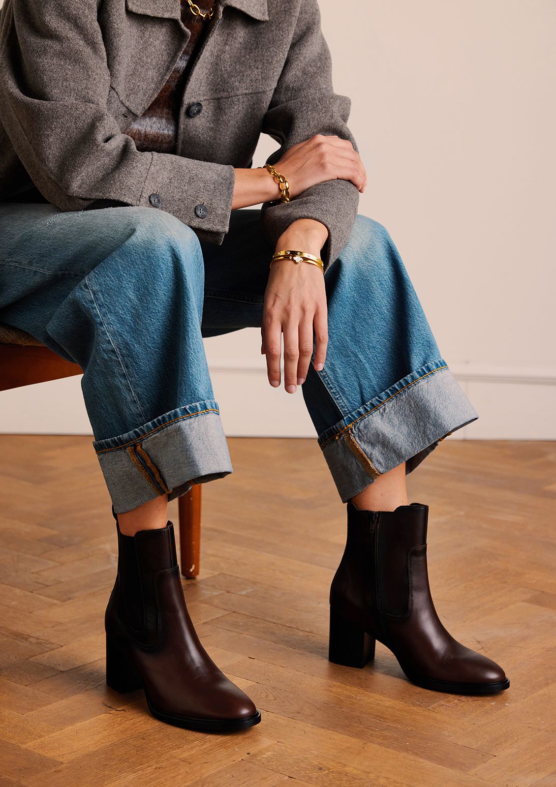 Dark brown block-heel ankle boots with cuffed wide-leg jeans and a grey tweed jacket