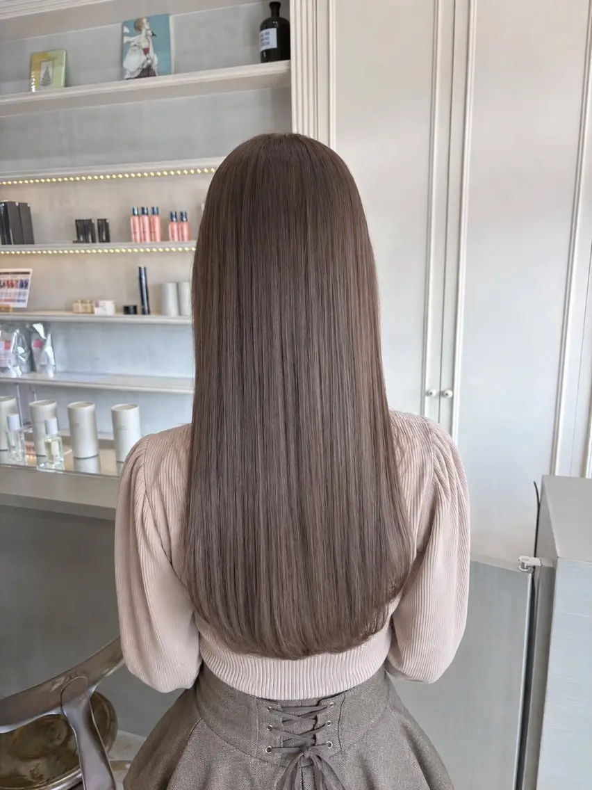 Long sleek straight hair in light ash brown color