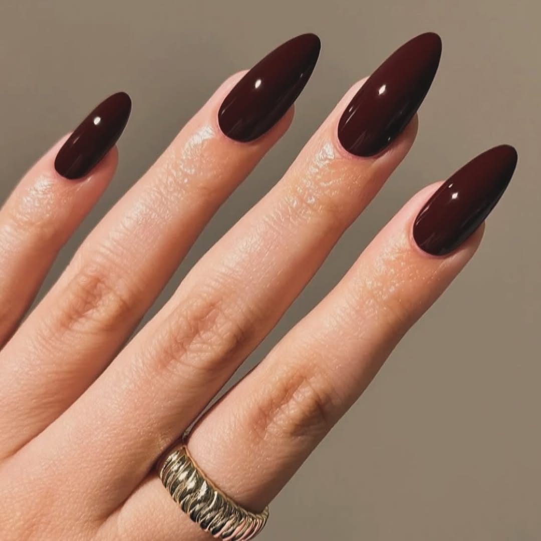 Oxblood Burgundy: a wine-red cream on medium almond nails
