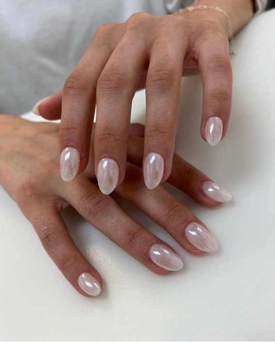 Medium almond creamy off-white nails with a glazed donut sheen