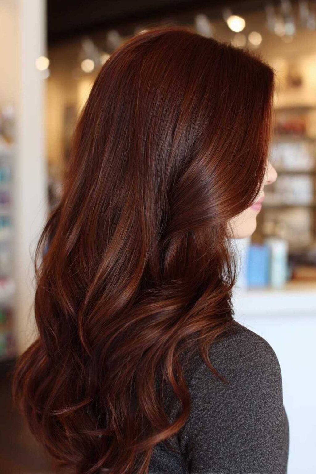 Dark mahogany brown hair with copper glow