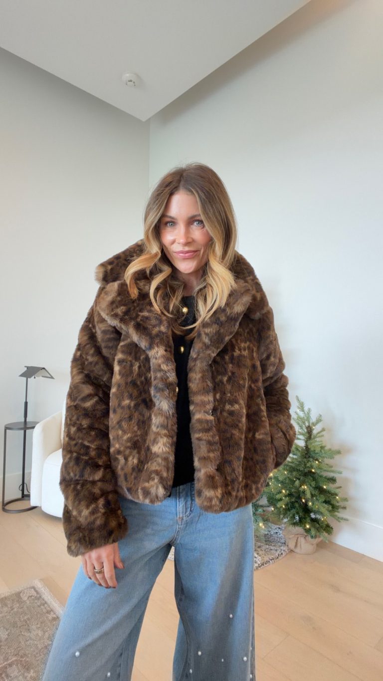 Cropped leopard faux fur jacket with black top and light-wash wide-leg jeans