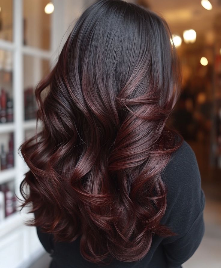 Dark brown hair with burgundy balayage