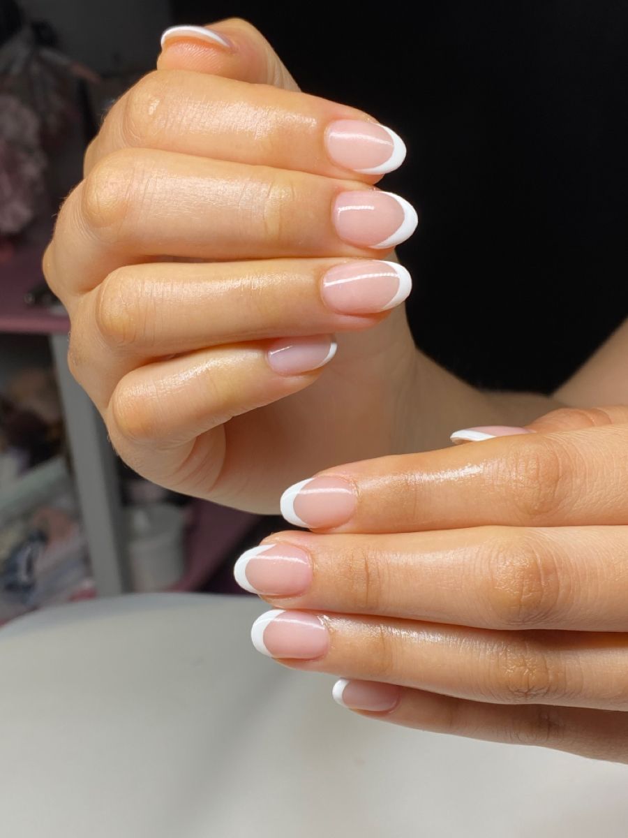 Micro french tips on short sheer pink nails
