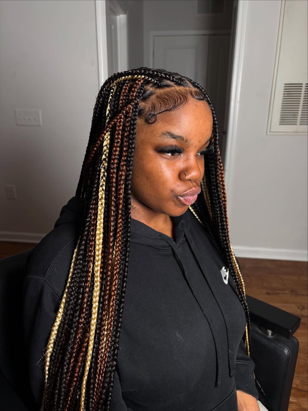 Black knotless braids with blonde and auburn accent braids