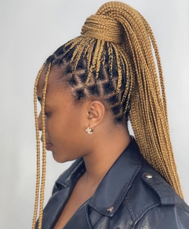 Honey blonde feed-in braided ponytail with dark roots