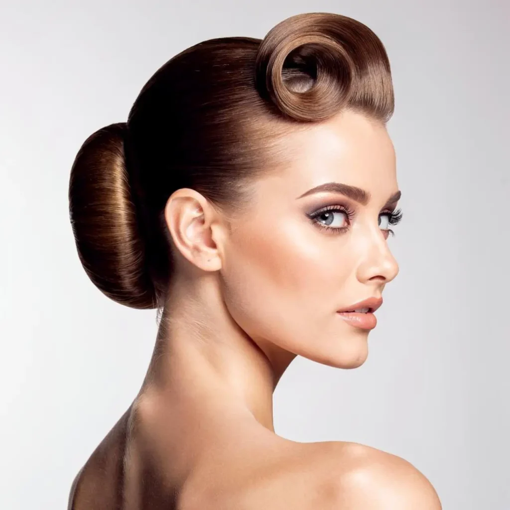 Auburn hair swept into an elegant french twist updo