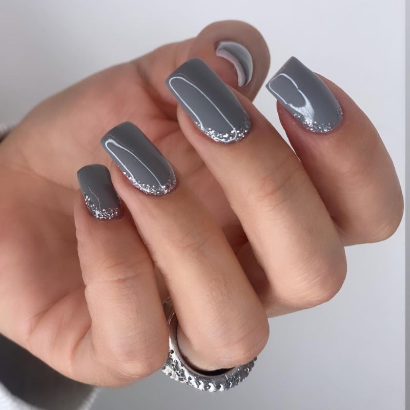Medium gray nails with sparkly silver glitter French tips