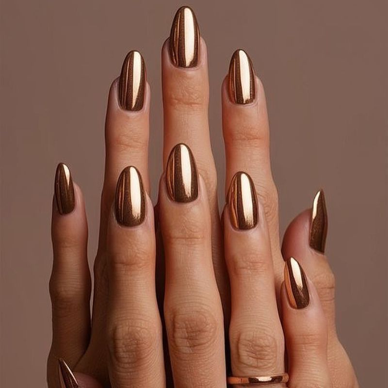 Antique Bronze: a metallic bronze on medium almond nails