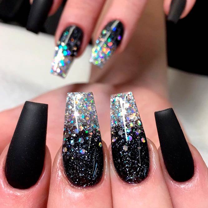 Matte black coffin acrylic nails with silver glitter ombre fading up from the tips on accent nails