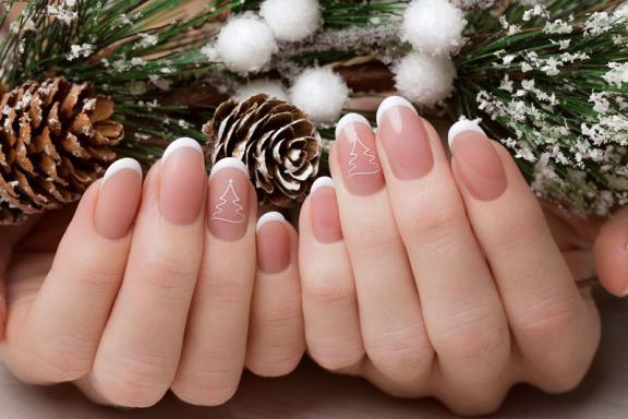 White french tips with tiny tree outline details on nude nails