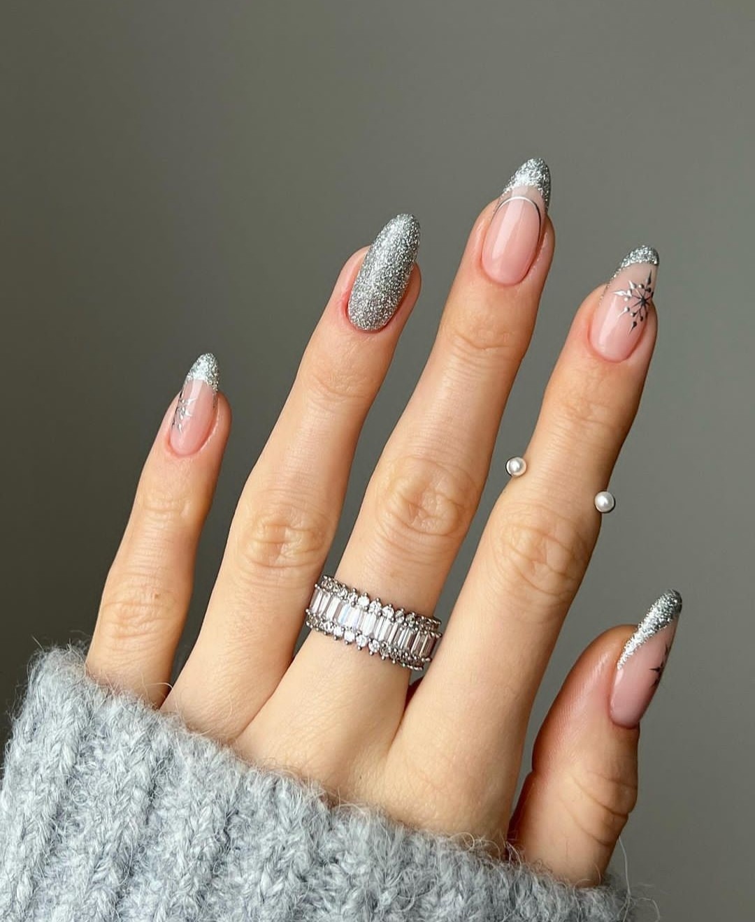 Icy silver chrome nails on medium almond nails