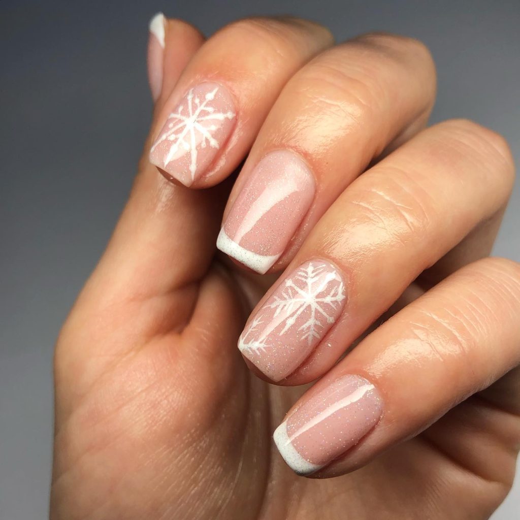 Short square French tip nails with tiny snowflakes