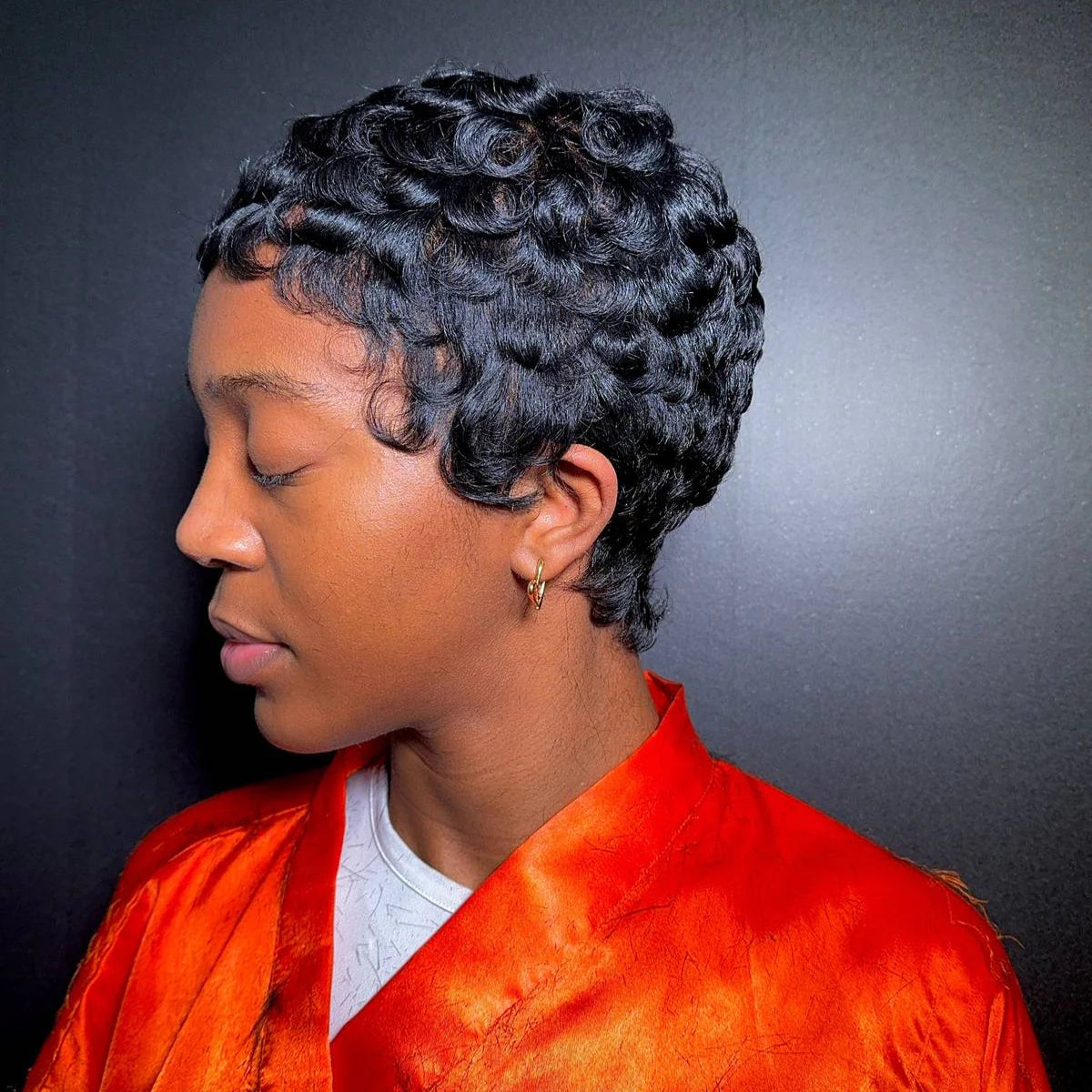 Short pixie cut with sculpted side-swept finger waves