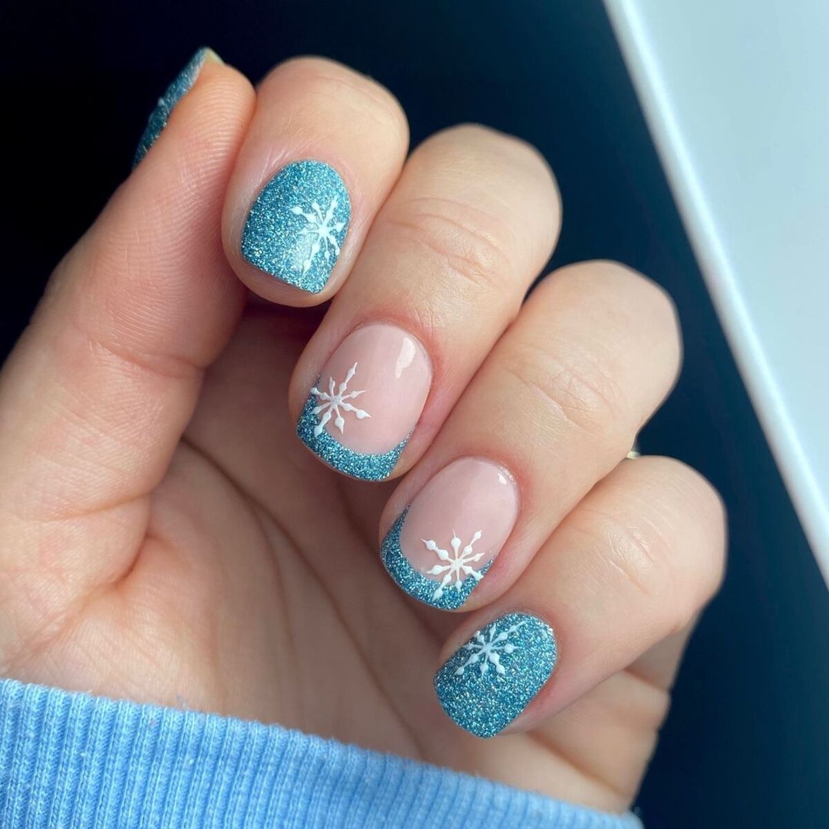 Icy blue glitter short square nails with white snowflake art