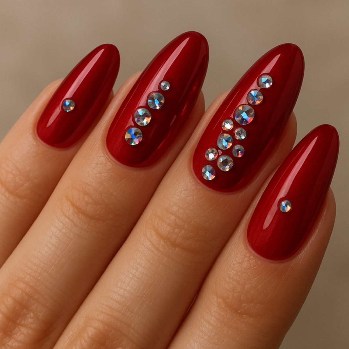 Cherry red nails with a line of small crystals along the cuticle