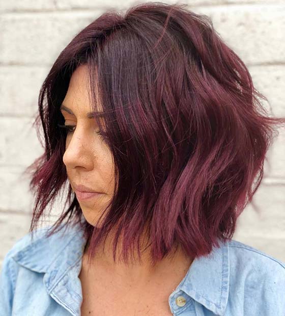 Wavy burgundy lob with tousled texture