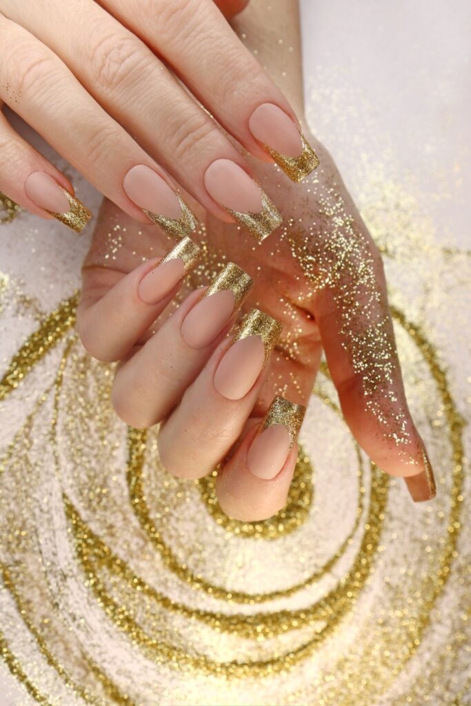 Full-coverage gold glitter nails