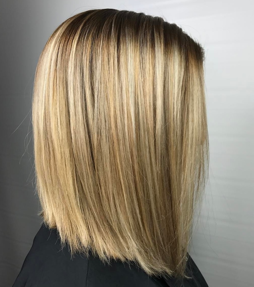 Honey blonde lob haircut with shadowed roots