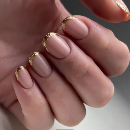 Short square nude nails with champagne glitter tips