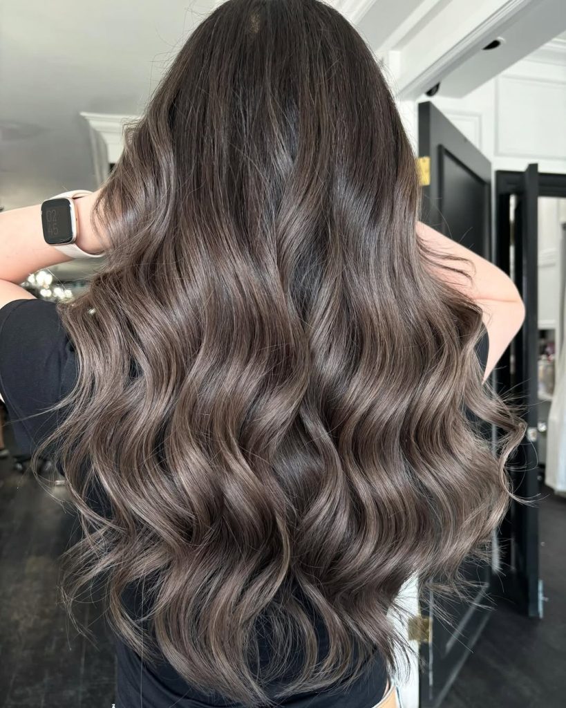 Smoky ash brown hair with cool muted tones and long layers