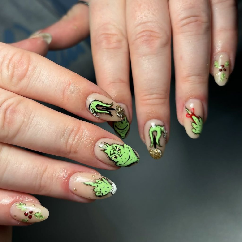 Medium almond nails with playful Grinch holiday character nail art