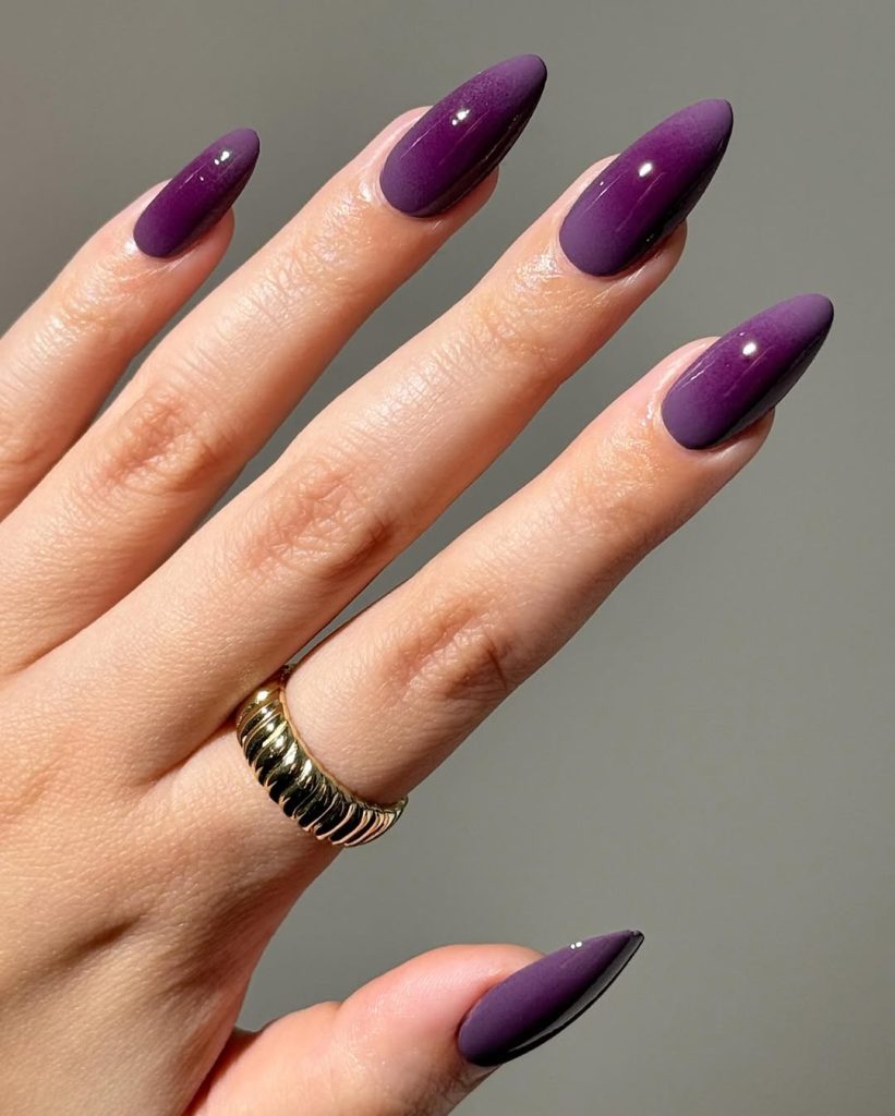 Deep berry-purple glossy almond nails