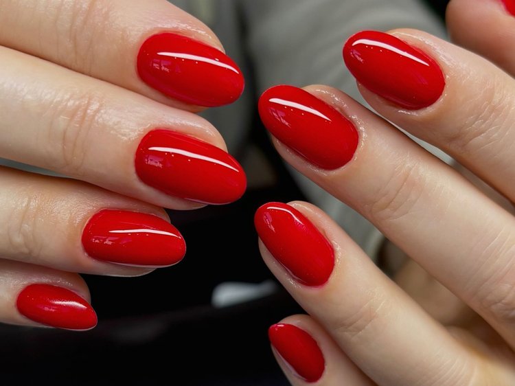 Short almond nails in classic glossy scarlet red