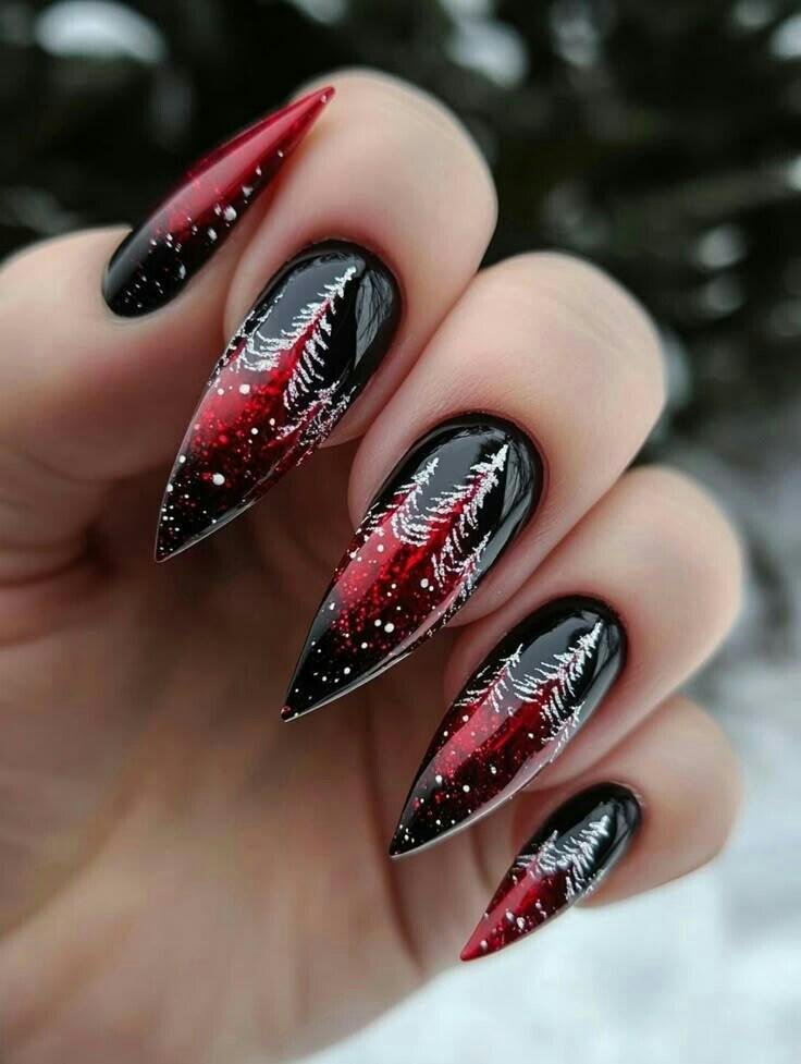 Black to red ombre stiletto nails with white pine tree art