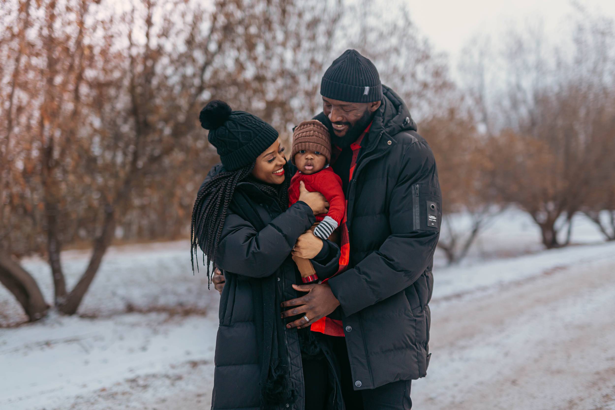 Family in black coats in an elegant winter portrait