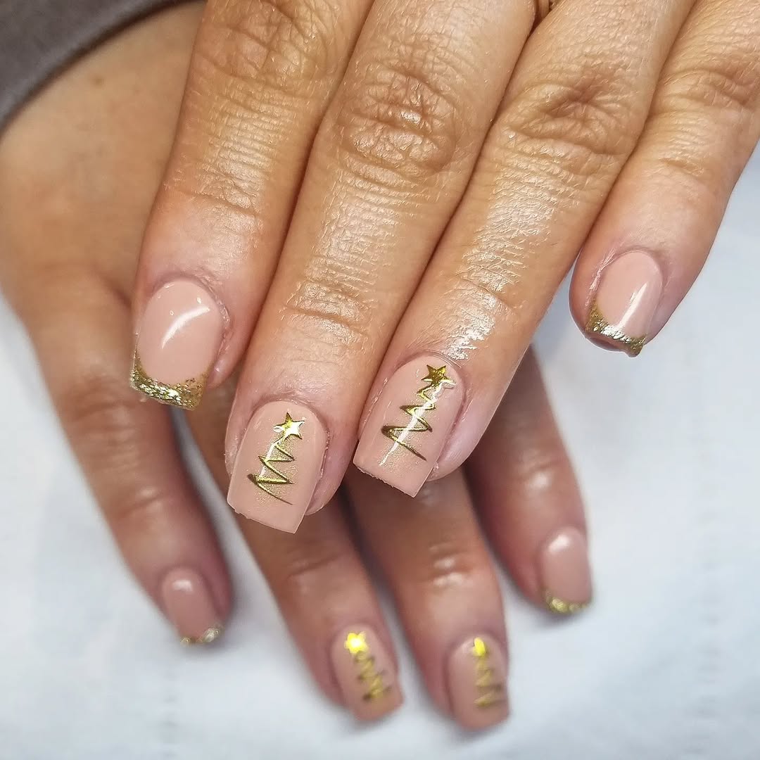 Short square nude nails with gold glitter French tips and gold Christmas tree line art