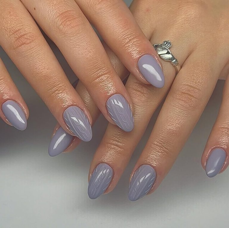 Glossy gray-lavender almond nails with subtle cable-knit texture