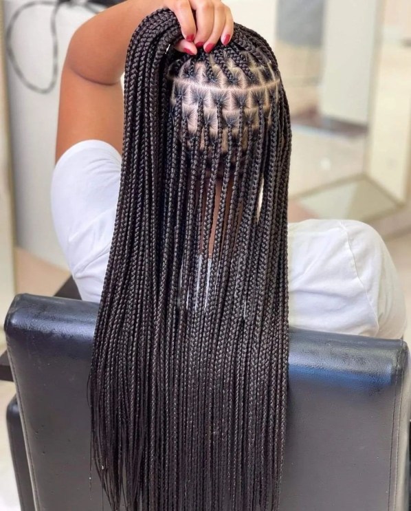 Back view of waist-length knotless braids with diamond parting