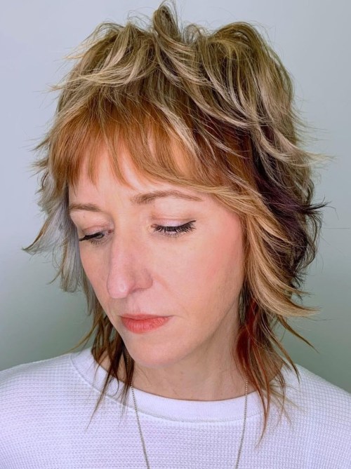 Razored wolf cut with feathered texture