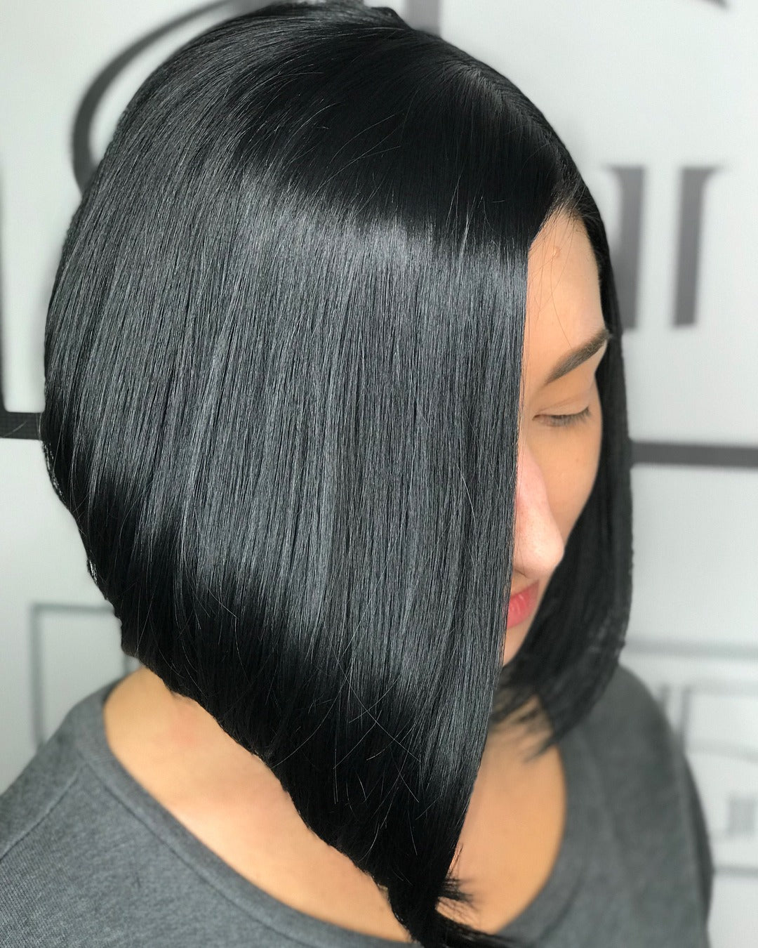 Jet black angled lob with glassy finish