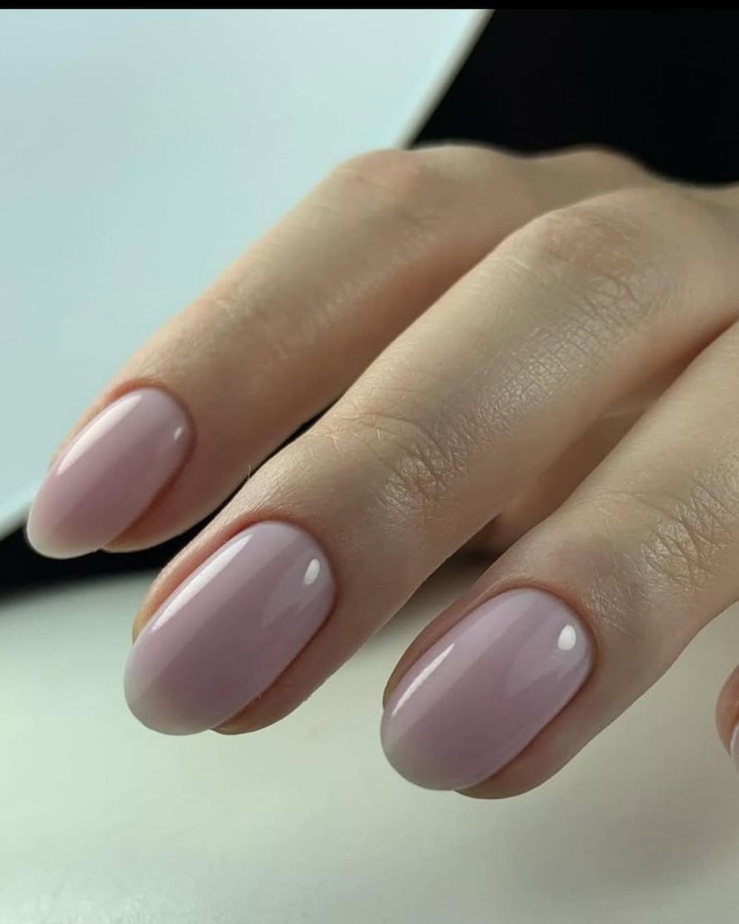 Dusty mauve creme nail polish on almond nails