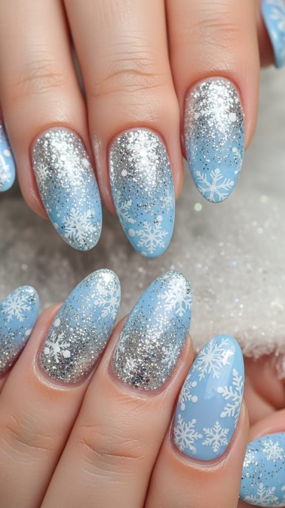 Frosty light blue gel nails with silver glitter and white snowflake art