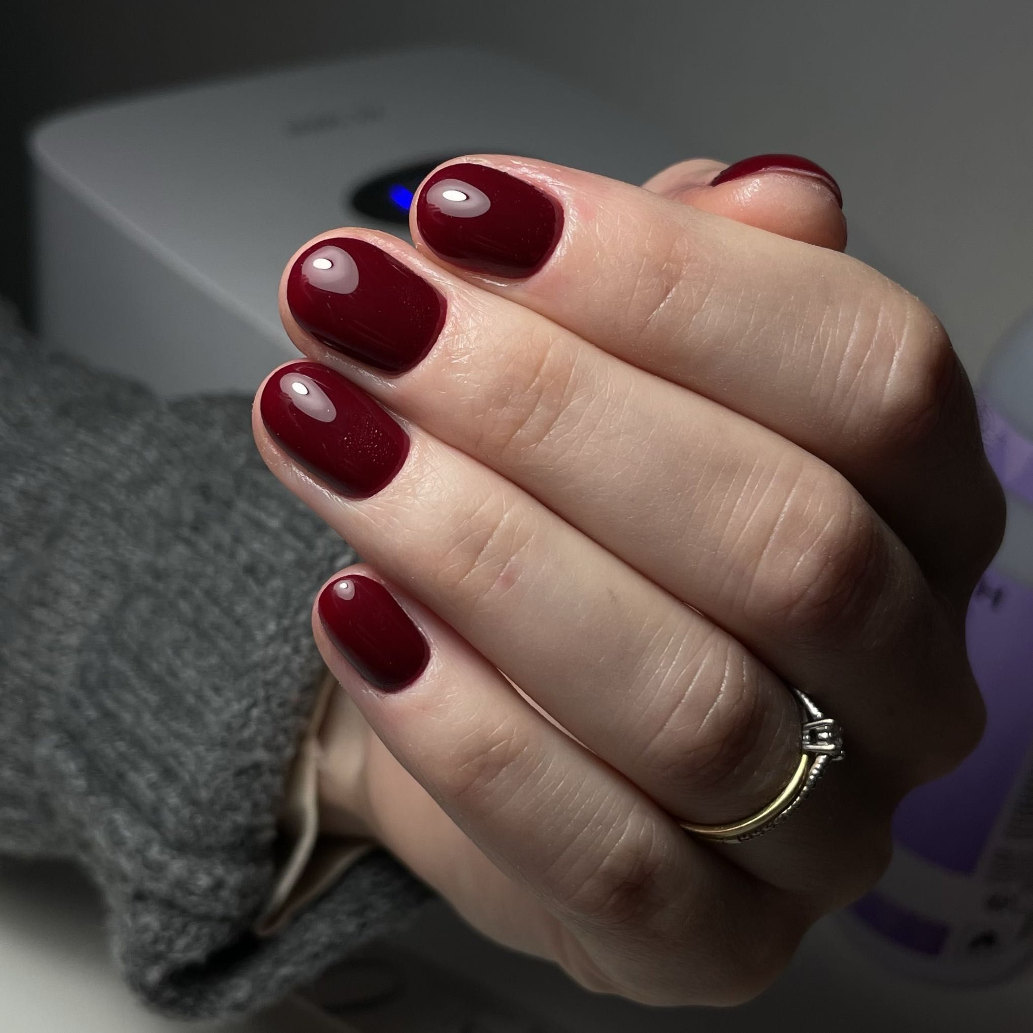 Short nails in dark oxblood red jelly polish