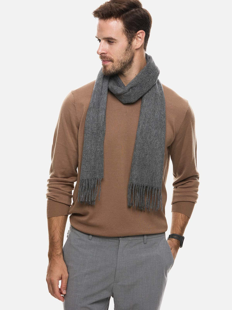 Cashmere scarf styled as the focal point of a winter outfit