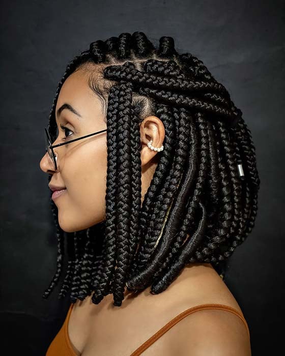Side-swept braided bob with a deep side part