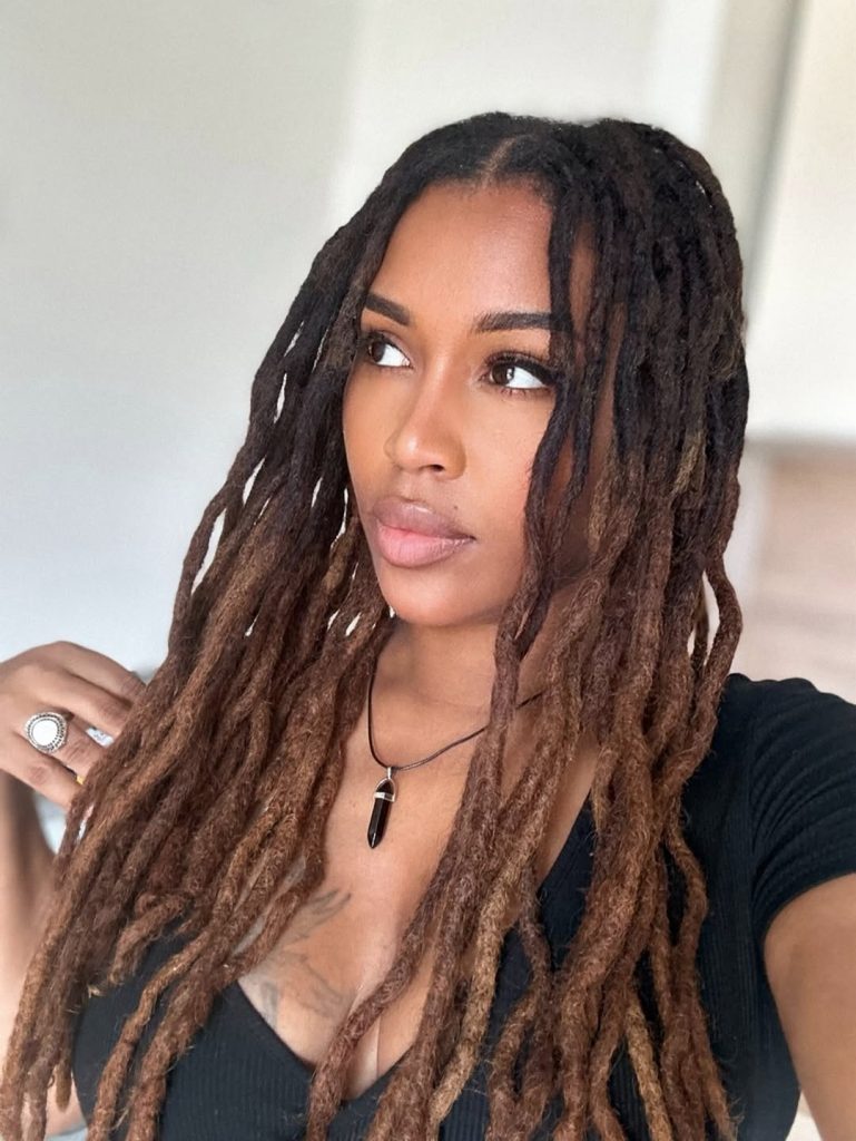 Goddess locs with dark roots and golden ombre ends