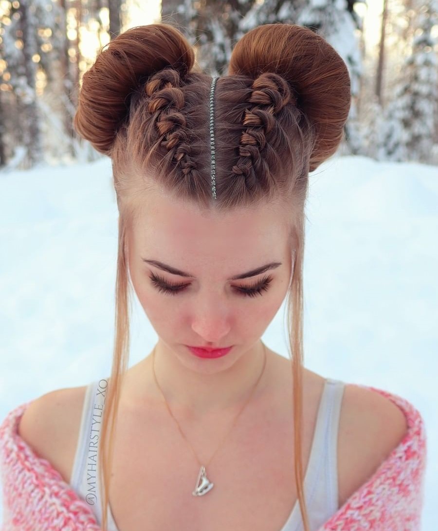 Space buns hairstyle with loose face-framing strands