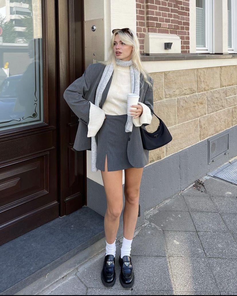 Oversized grey blazer with a mini skirt and loafers
