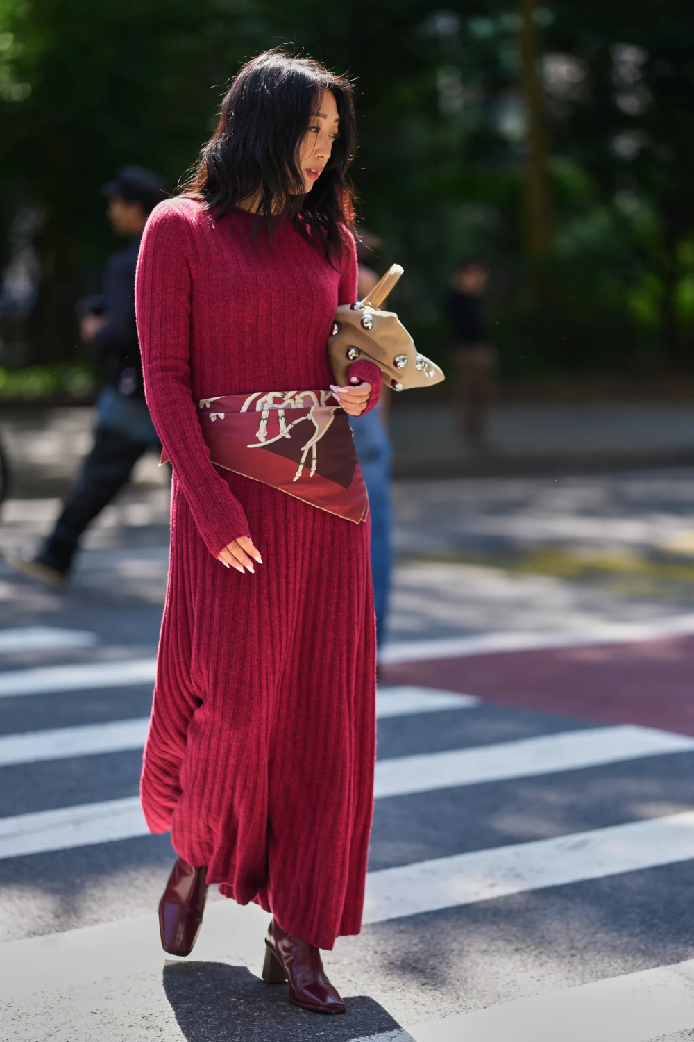 Burgundy boots with a neutral outfit