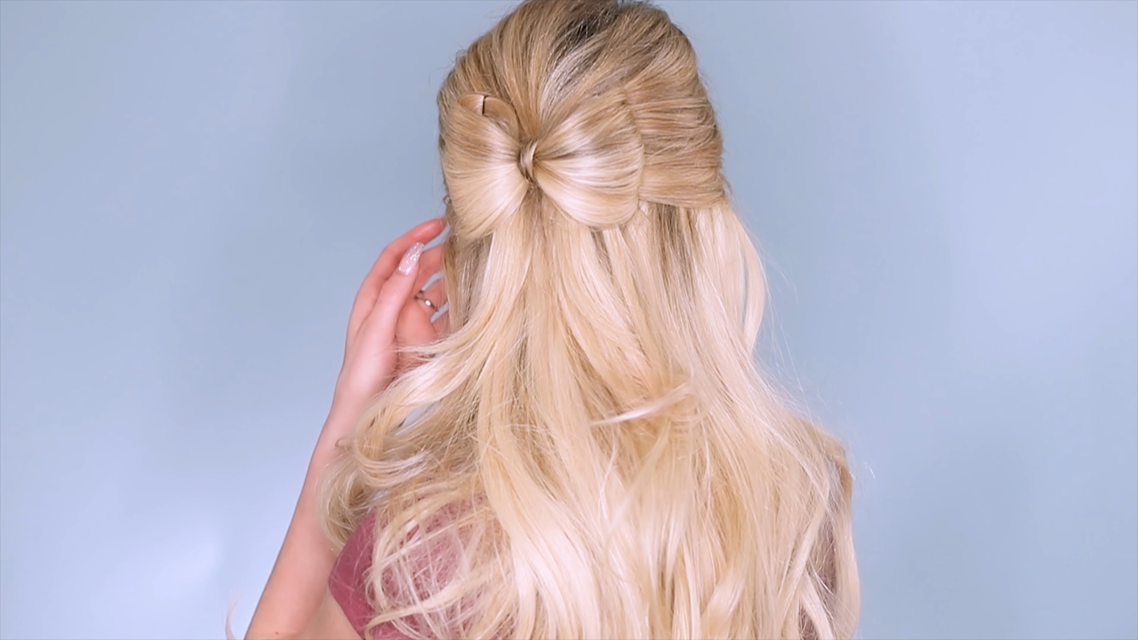 Hair bow made from hair in a half-up style
