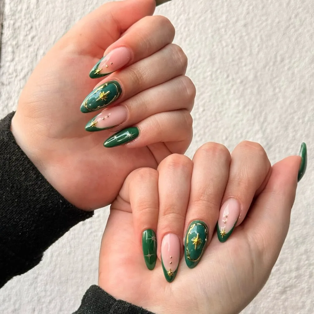 Long almond dark green and nude nails with gold star nail art