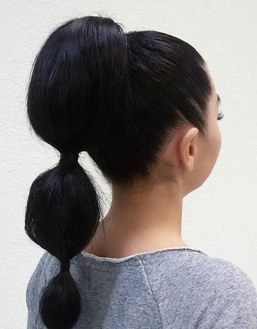 High bubble ponytail with even puffed sections down the length