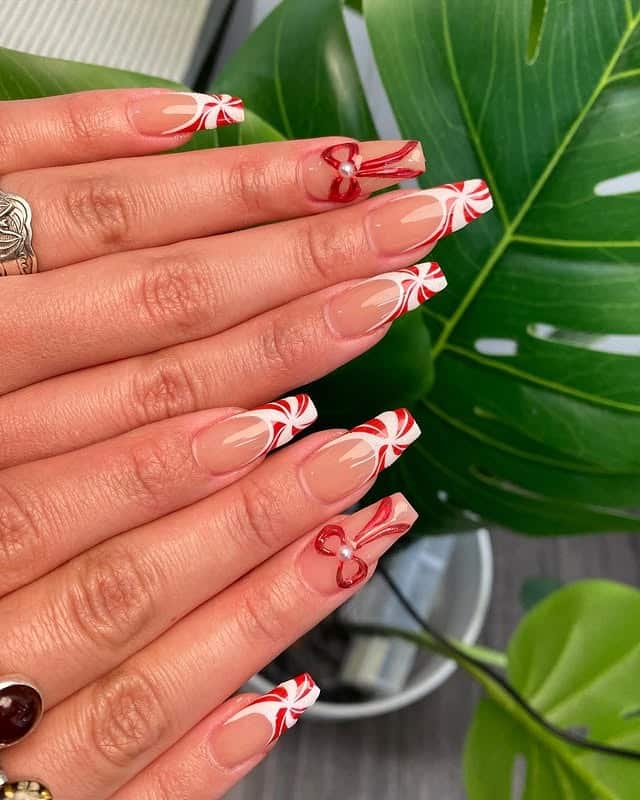 Candy cane striped French tip nails